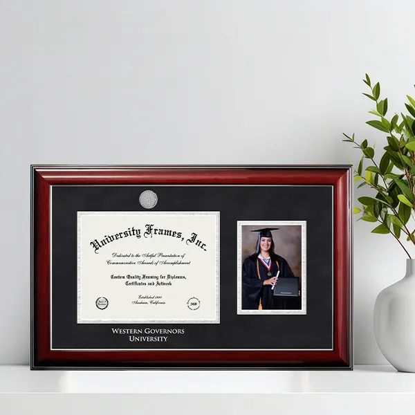 A graduate holding a diploma frame