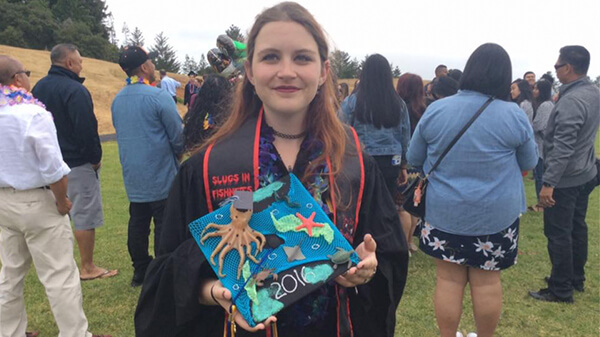 College Girl Holding Graduation Cap