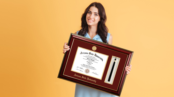 Girl holding diploma frames