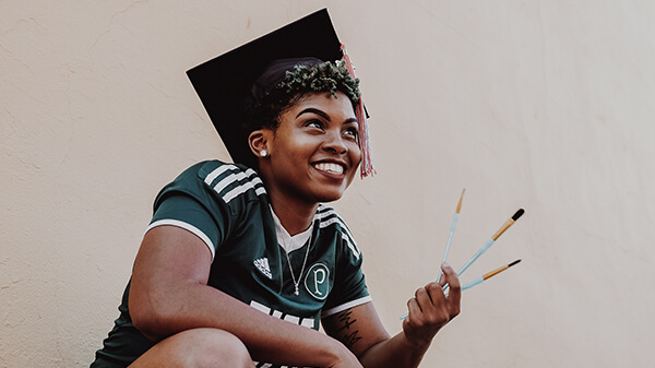Girl With Graduation Cap and Paint Brush